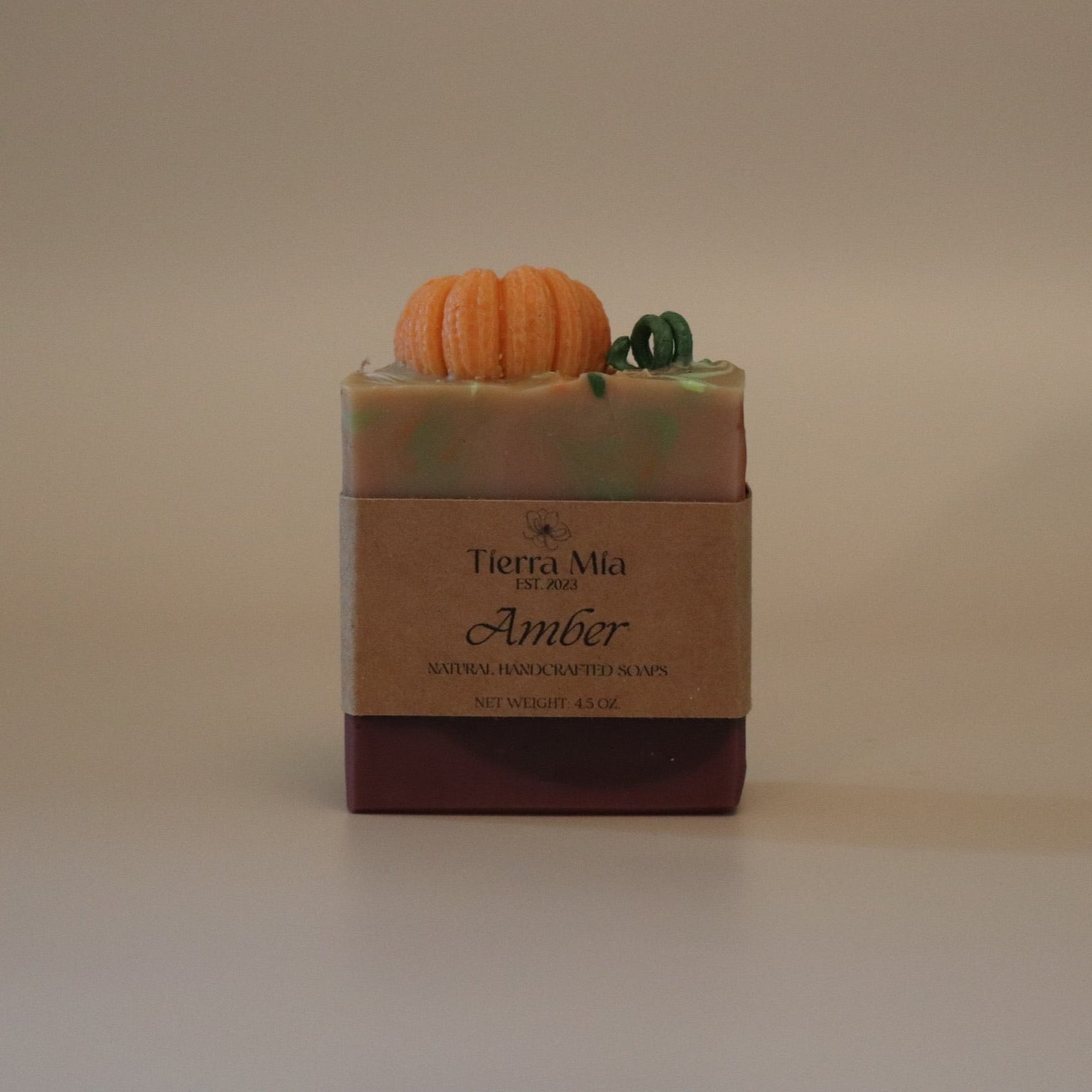 Bar of soap with a decorative element on a beige background
