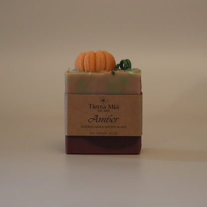 Bar of soap with a decorative element on a beige background