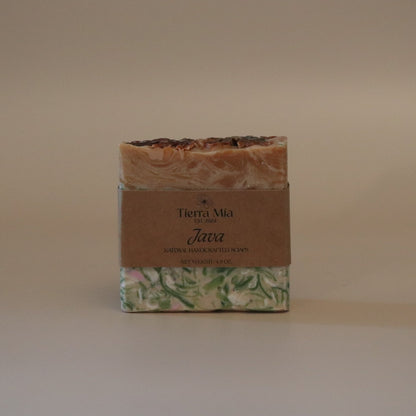Bar of soap with a decorative label on a beige background