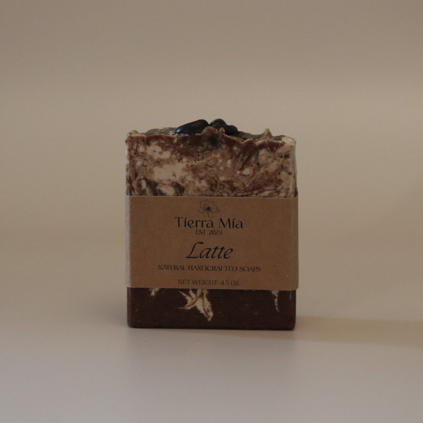 Bar of soap with a brown label on a beige background