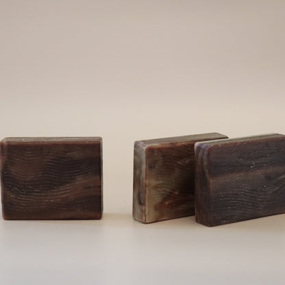 Three wooden blocks of different sizes on a beige background