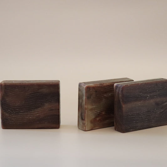 Three wooden blocks of different sizes on a beige background