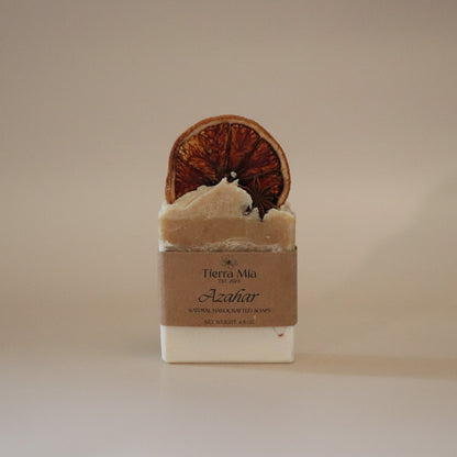 Bar of soap with a decorative top on a beige background