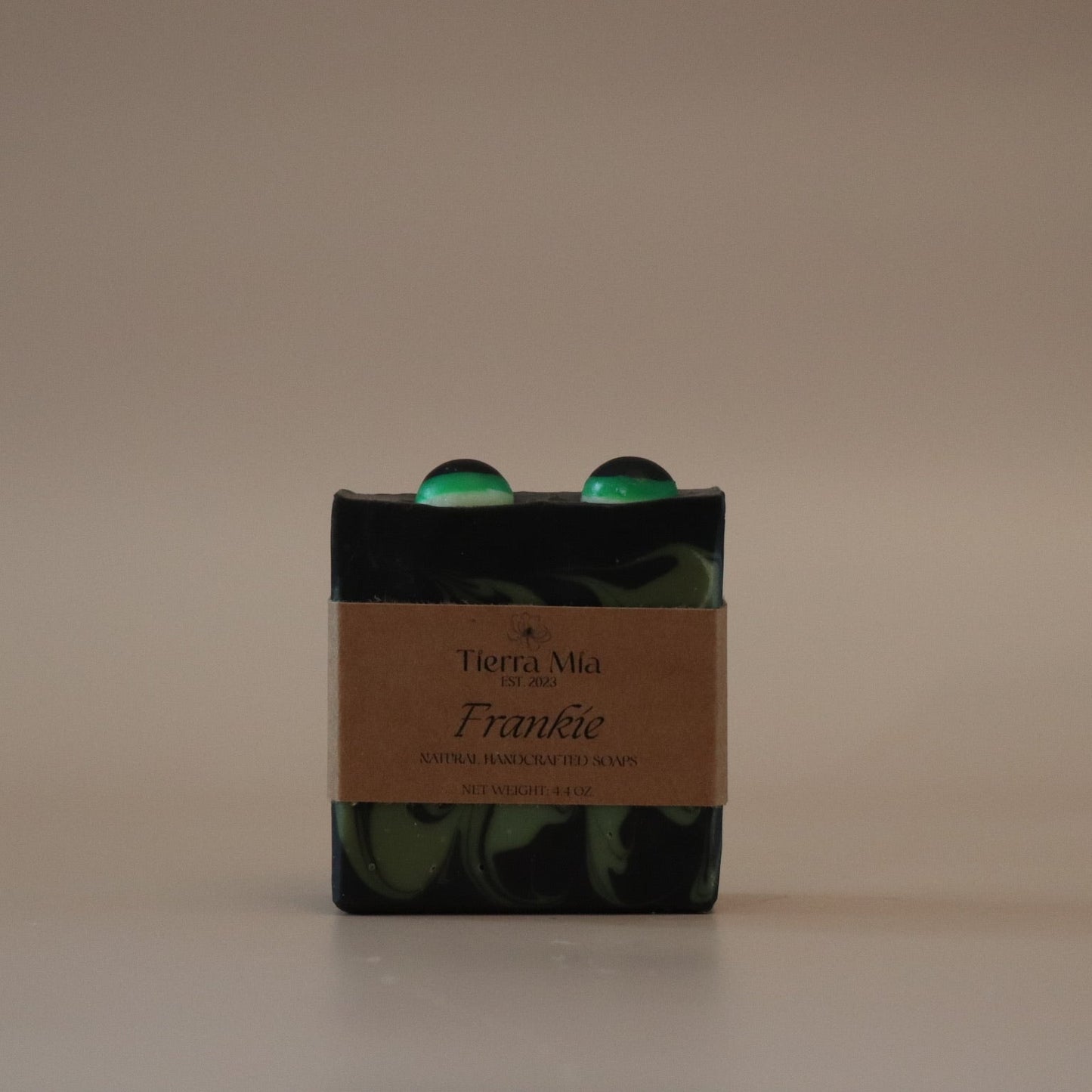 Bar of soap with a brown label on a beige background
