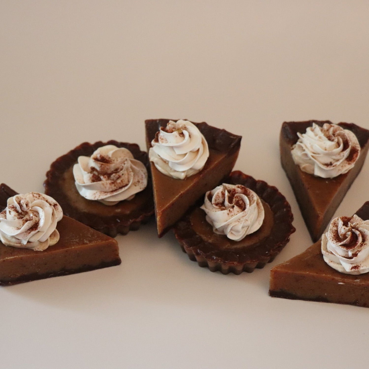 pumpkin pie sliced soap bars with whipped cream on a light background