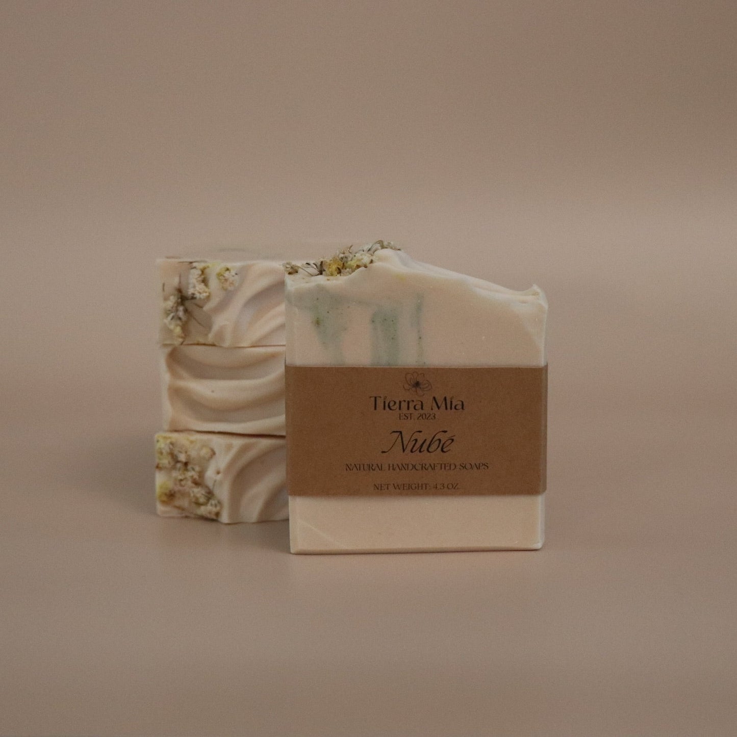 Bar of soap with packaging on a beige background
