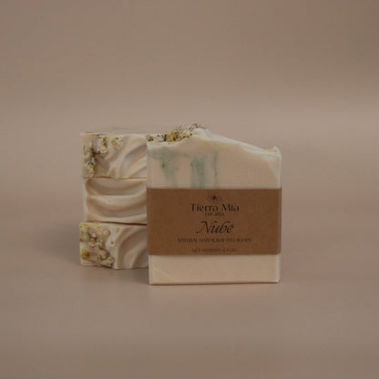 Bar of soap with packaging on a beige background