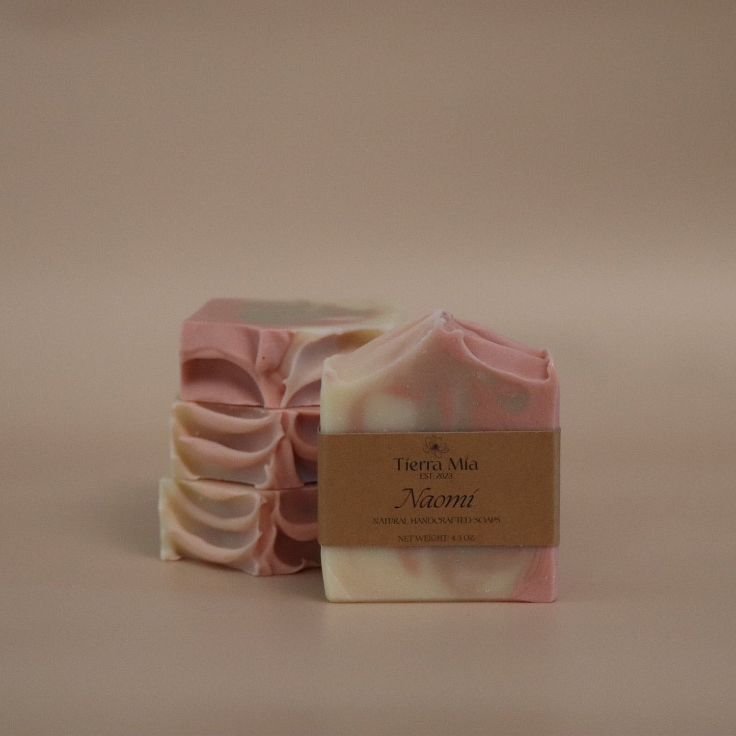 Bar of soap with a visible brand label on a beige background