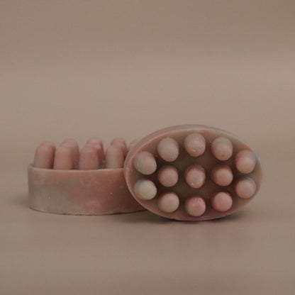 Pink & Brown massage bar soap on a beige background
