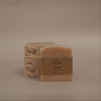 Two bars of soap with a label on a beige background