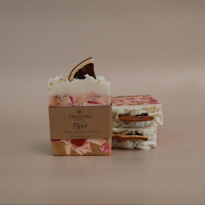 Two floral soap bars with a brown box labeled 'Terra Mia' on a beige background