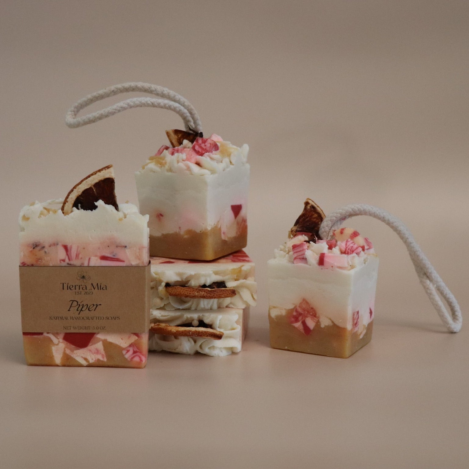 Decorative soap pieces with peppermint designs on a beige background