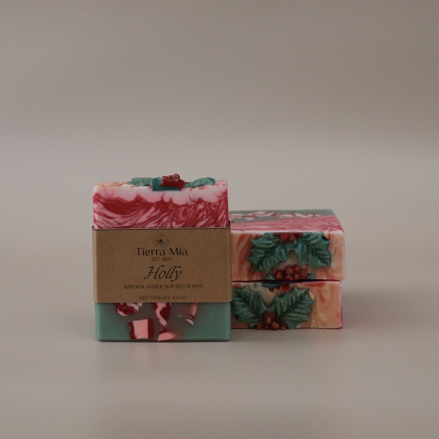 Two soap bars with a decorative pattern on a beige background