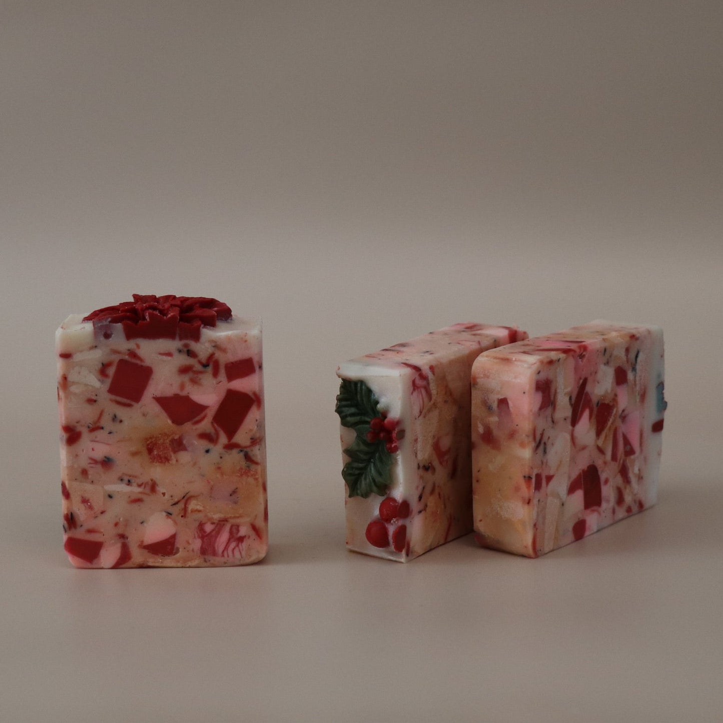 Two rectangular blocks of floral soap on a plain background