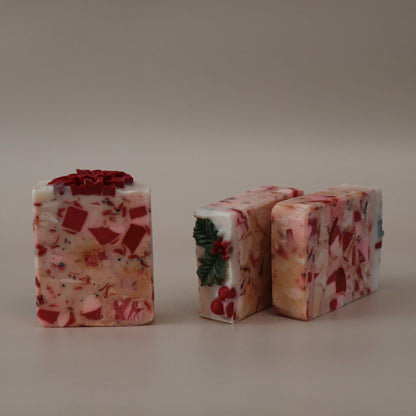 Two rectangular blocks of floral soap on a plain background