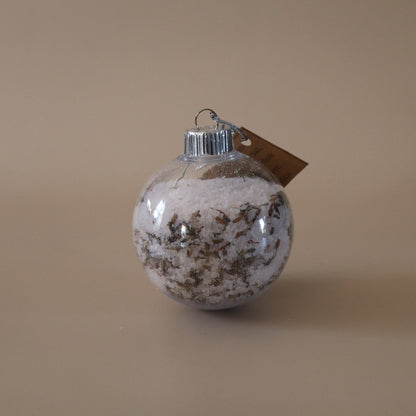 Decorative ornament with a brown tag on a beige background