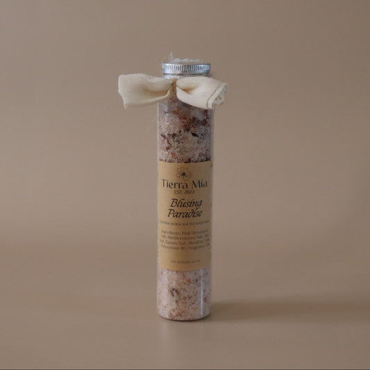 Cylindrical bath salt with a label on a beige background