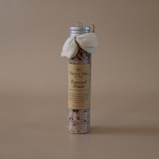 Small cylindrical product with a label on a beige background